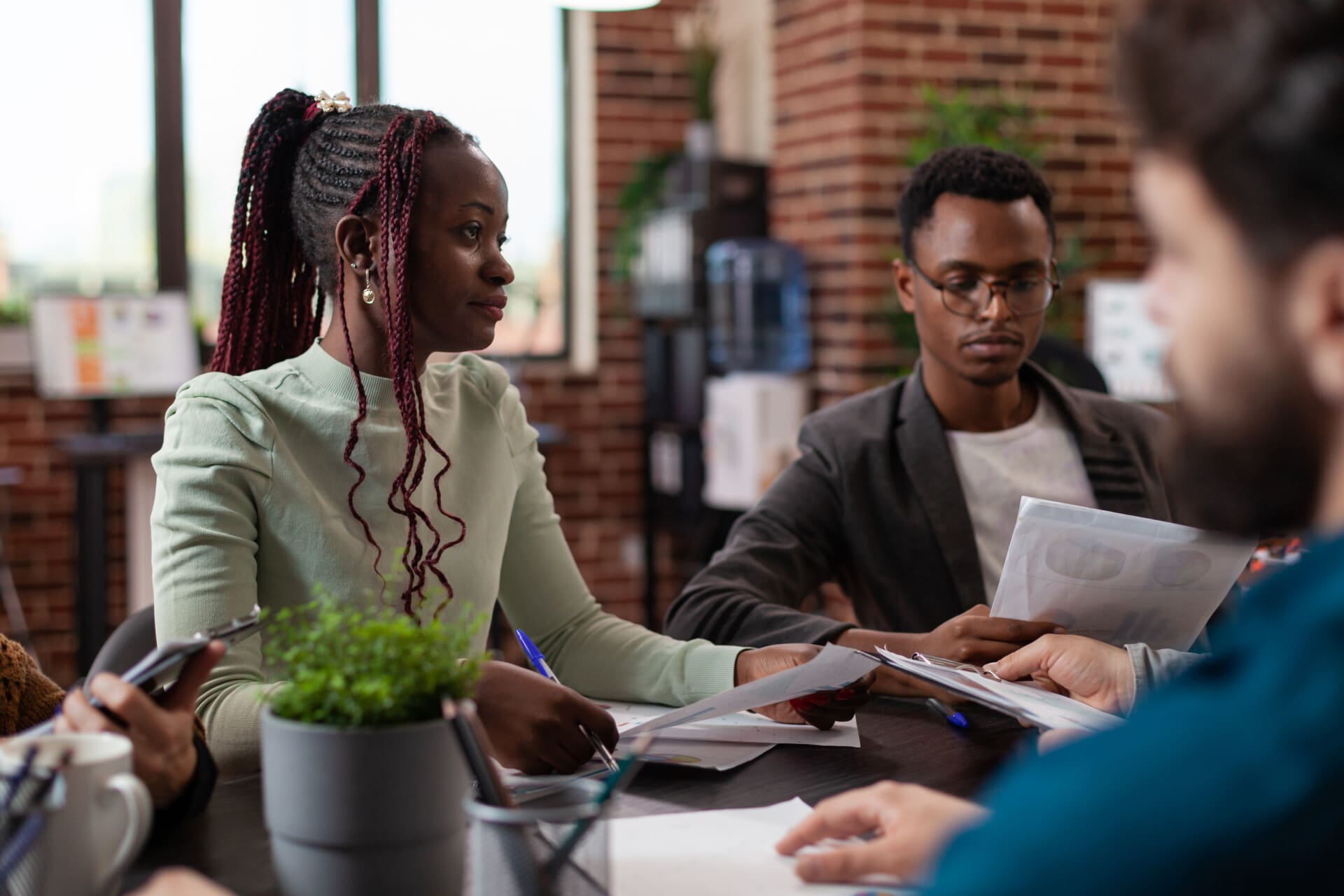 Diverse team sharing papers with marketing strategy