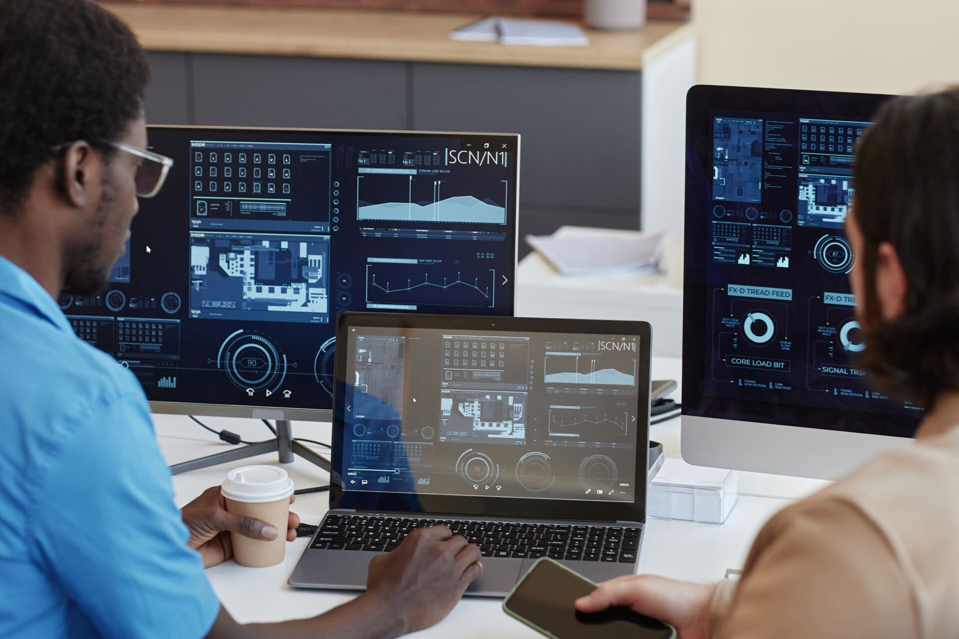 Focus on laptop with statistic graphic data on screen and IT manager